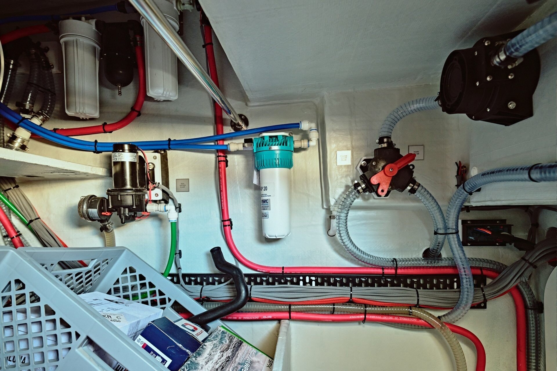 Technical locker on Pegasus 50 showing water filter in the middle of the photo.